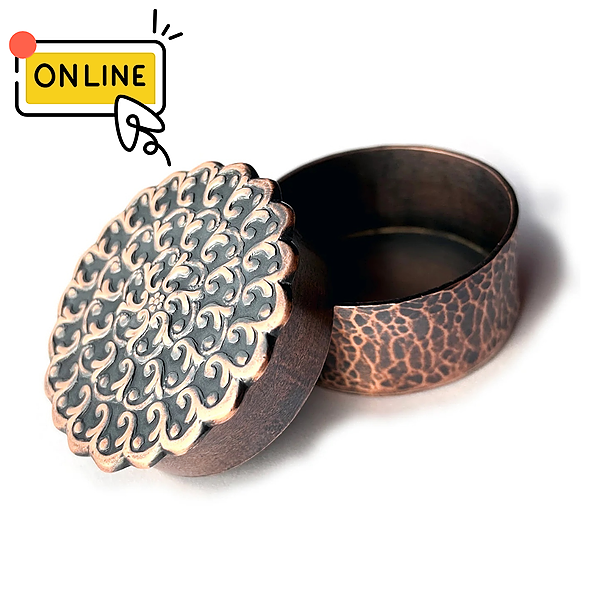 Hammered copper box with a pierced floral lid, made in Lynette Andreasen's Put a Lid On It online metalsmithing workshop