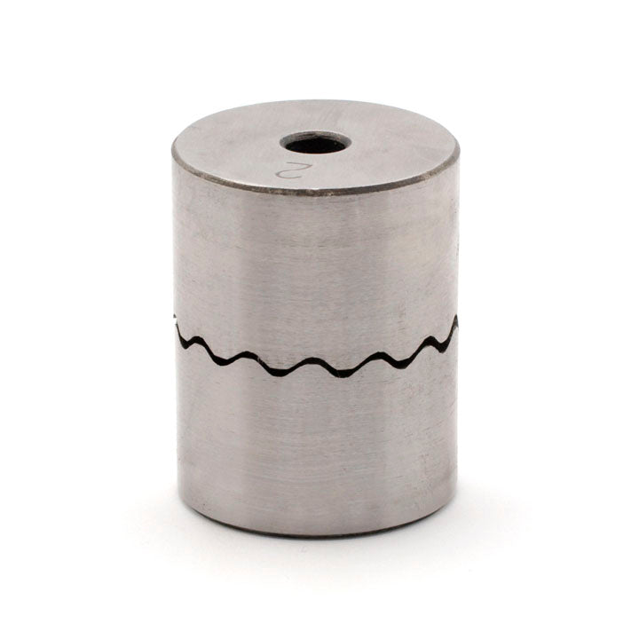 Cylindrical steel hoop-forming press die with a wavy line around the middle and a hole through the top face.